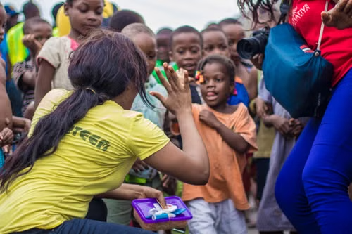A volunteer connecting with children during a community project